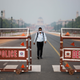 A man walks on a deserted street leading to the Presidential Palace during a government-imposed lockdown as a preventive measure against covid-19 in New Delhi, India, on March 24.